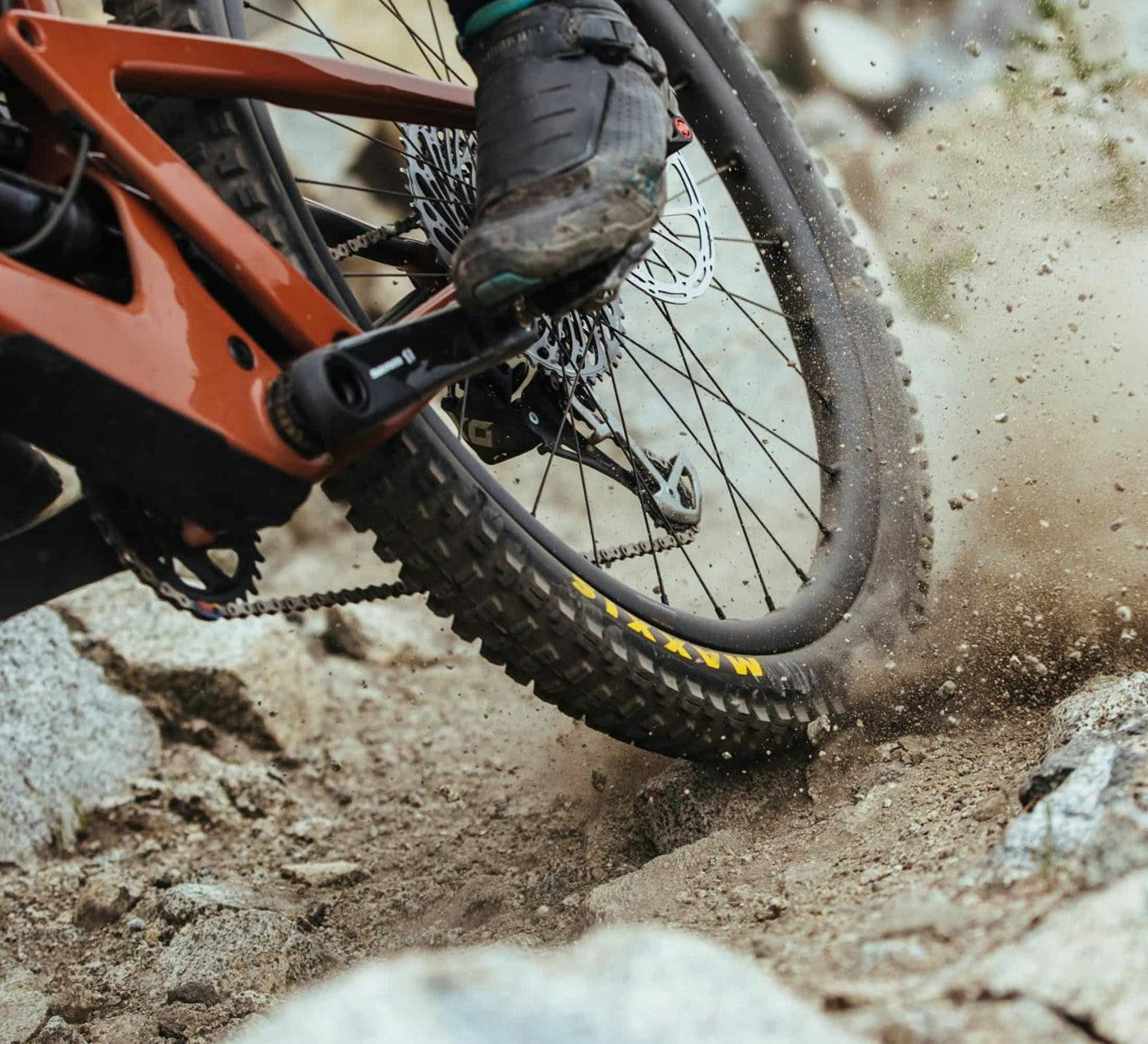 kicking up dirt and rocks from a maxxis tire on the Santa Cruz Bronson