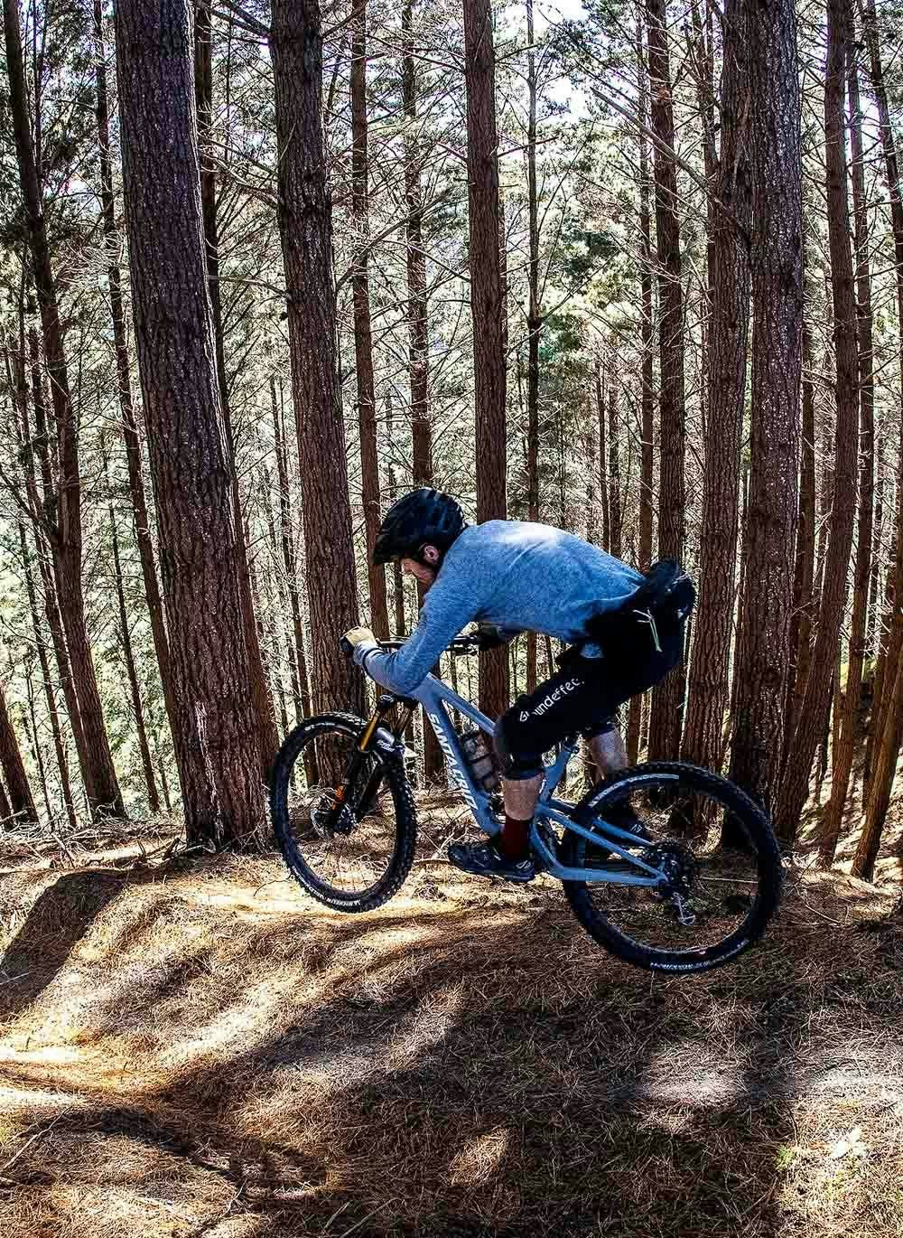 Jamie Nicoll riding his mountain bike in the forest