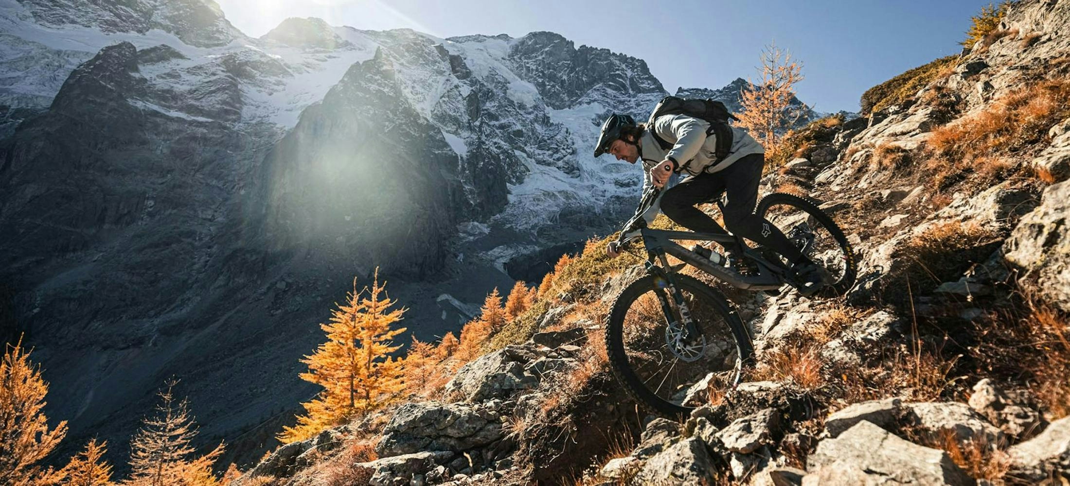 Loic D, riding his Santa Cruz mountain bike down a rock trail 