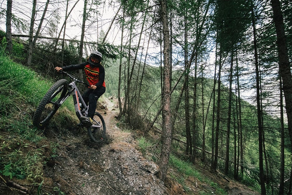 Riding the Nomad 6 down a steep singletrack trail