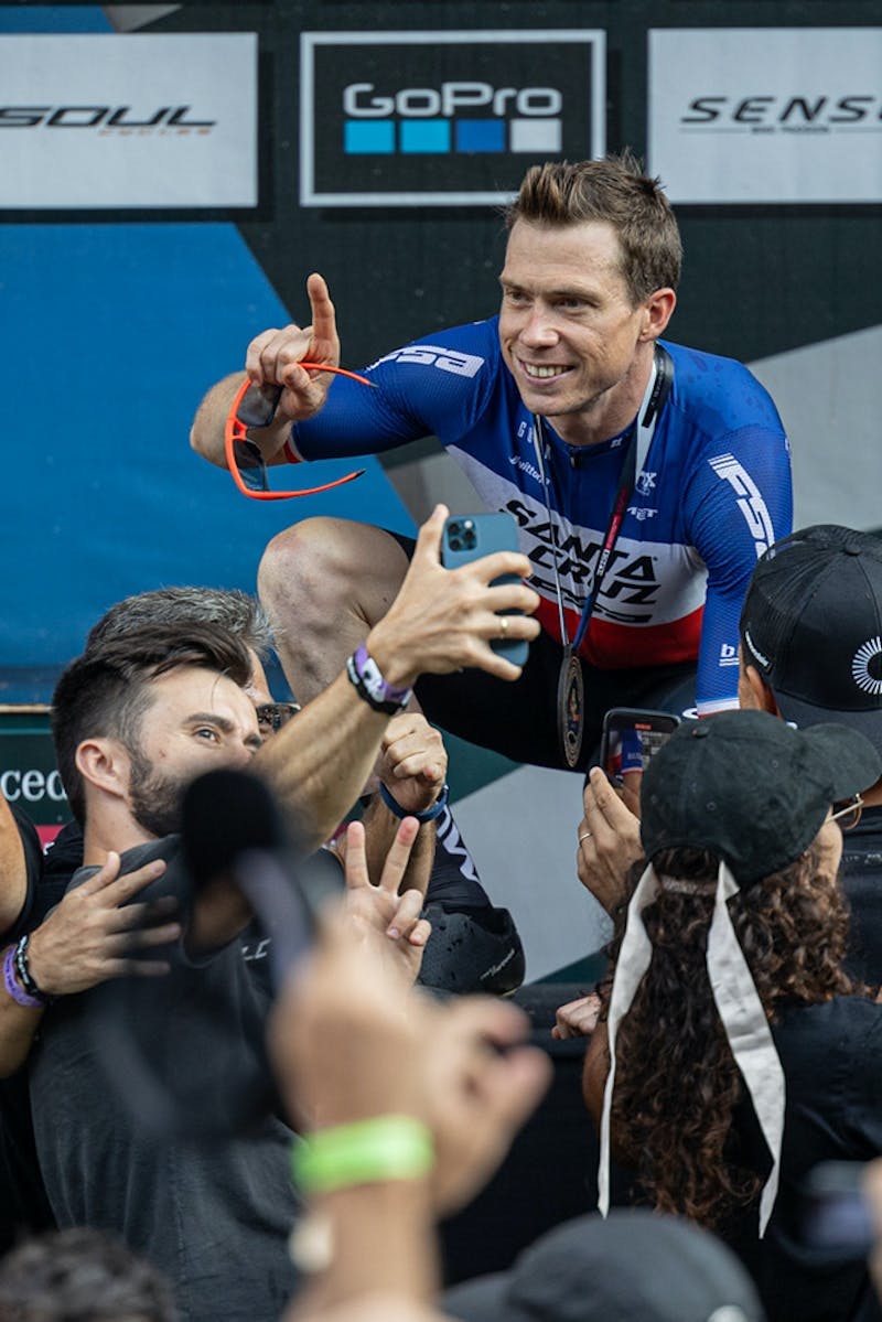Maxime Marotte posing for fans on the podium of the Men's elite XCO