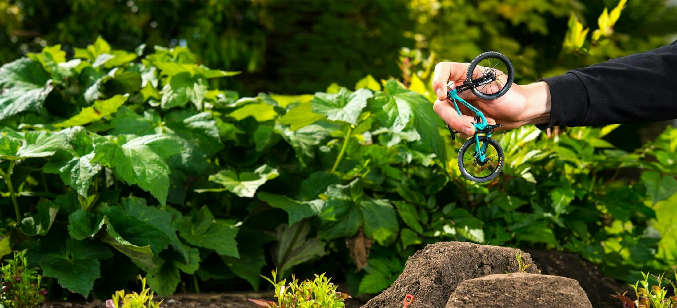 The 5010 finger-bike being jumped off of tiny dirt jumps