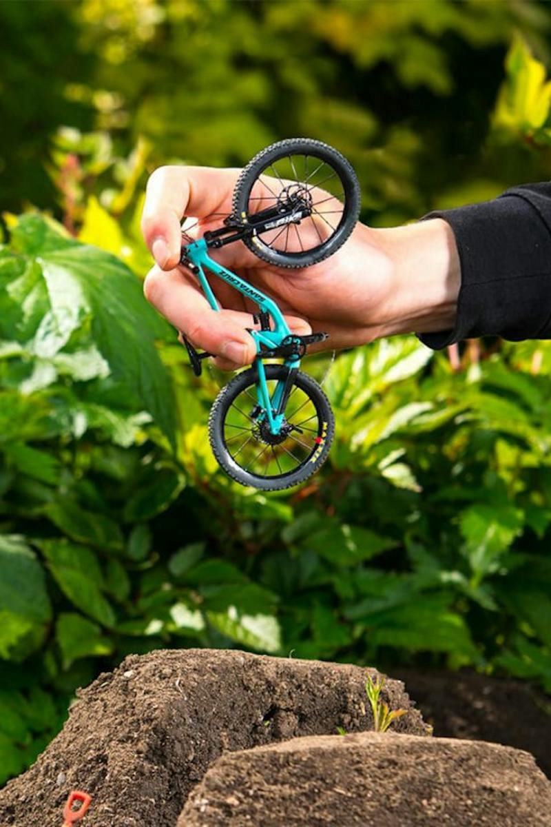 The 5010 finger-bike being jumped off of tiny dirt jumps