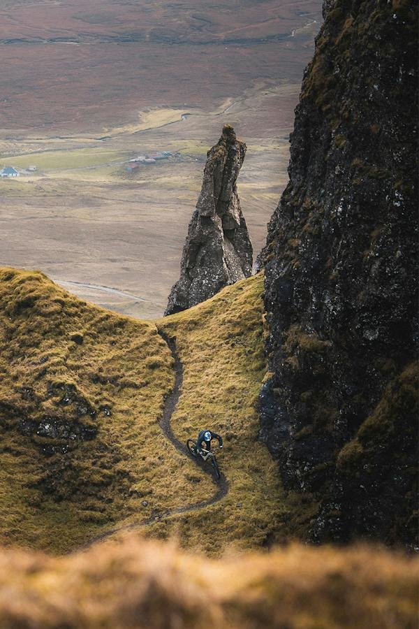 Danny MacAskill riding his Heckler eMTB down a rocky trail