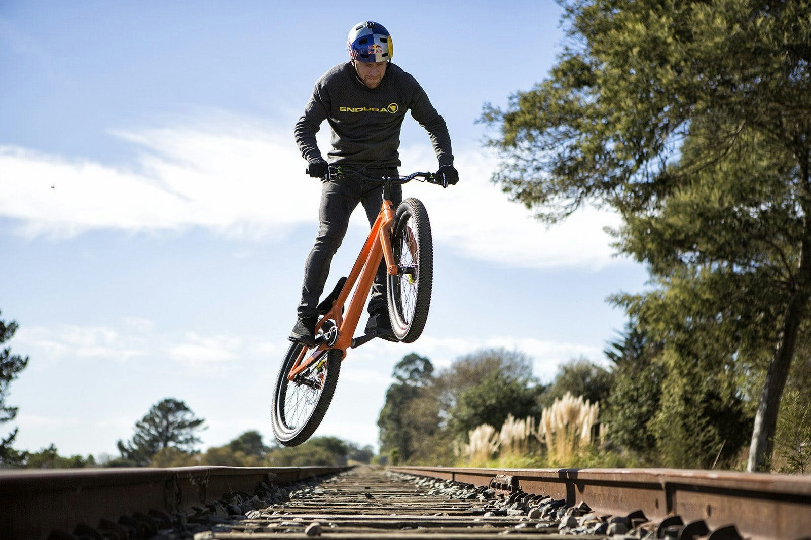 Danny Macaskill riding his Santa Cruz trials bike on train tracks in Santa Cruz California
