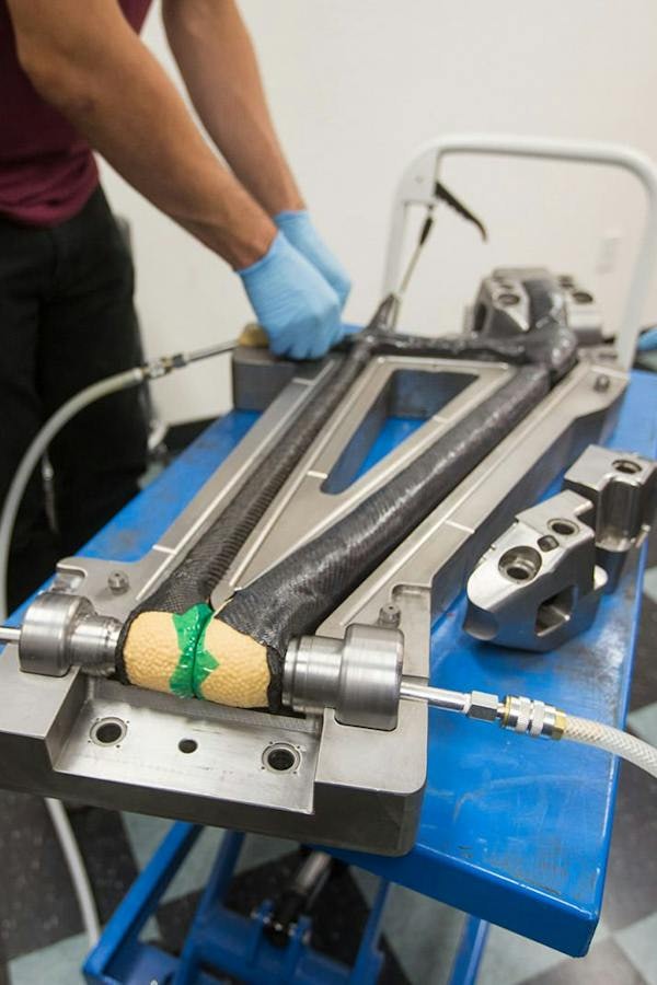Santa Cruz Bicycles engineer inflating the bladder inside if the frame of the Danny Macaskill bike 